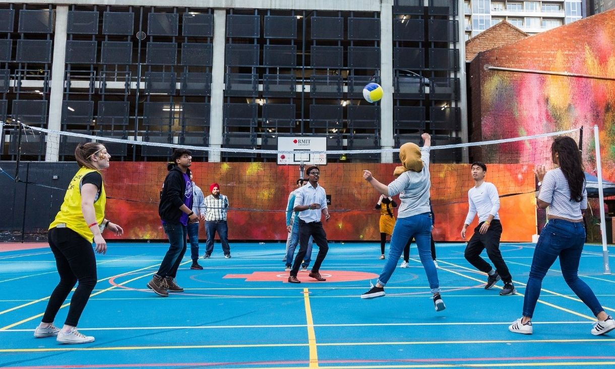 Students play volleyball at RMIT.
